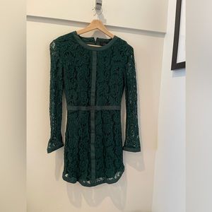 Green lace long sleeved mini dress in size M